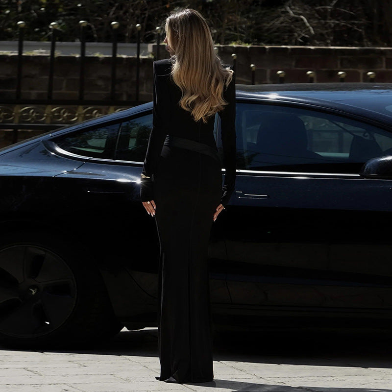 High-neck, fitted, padded-shoulder, long-sleeved, sophisticated dark-toned dress
