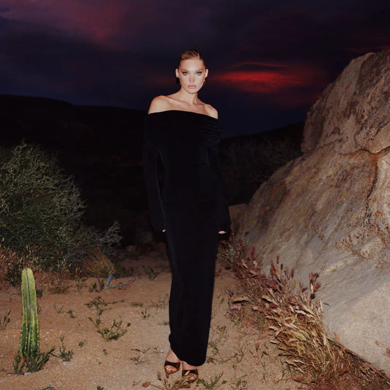 Black off-the-shoulder dress with metal ring design and high slit long sleeves.