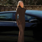 High-neck, fitted, padded-shoulder, long-sleeved, sophisticated dark-toned dress