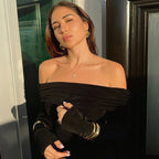Black off-the-shoulder dress with metal ring design and high slit long sleeves.